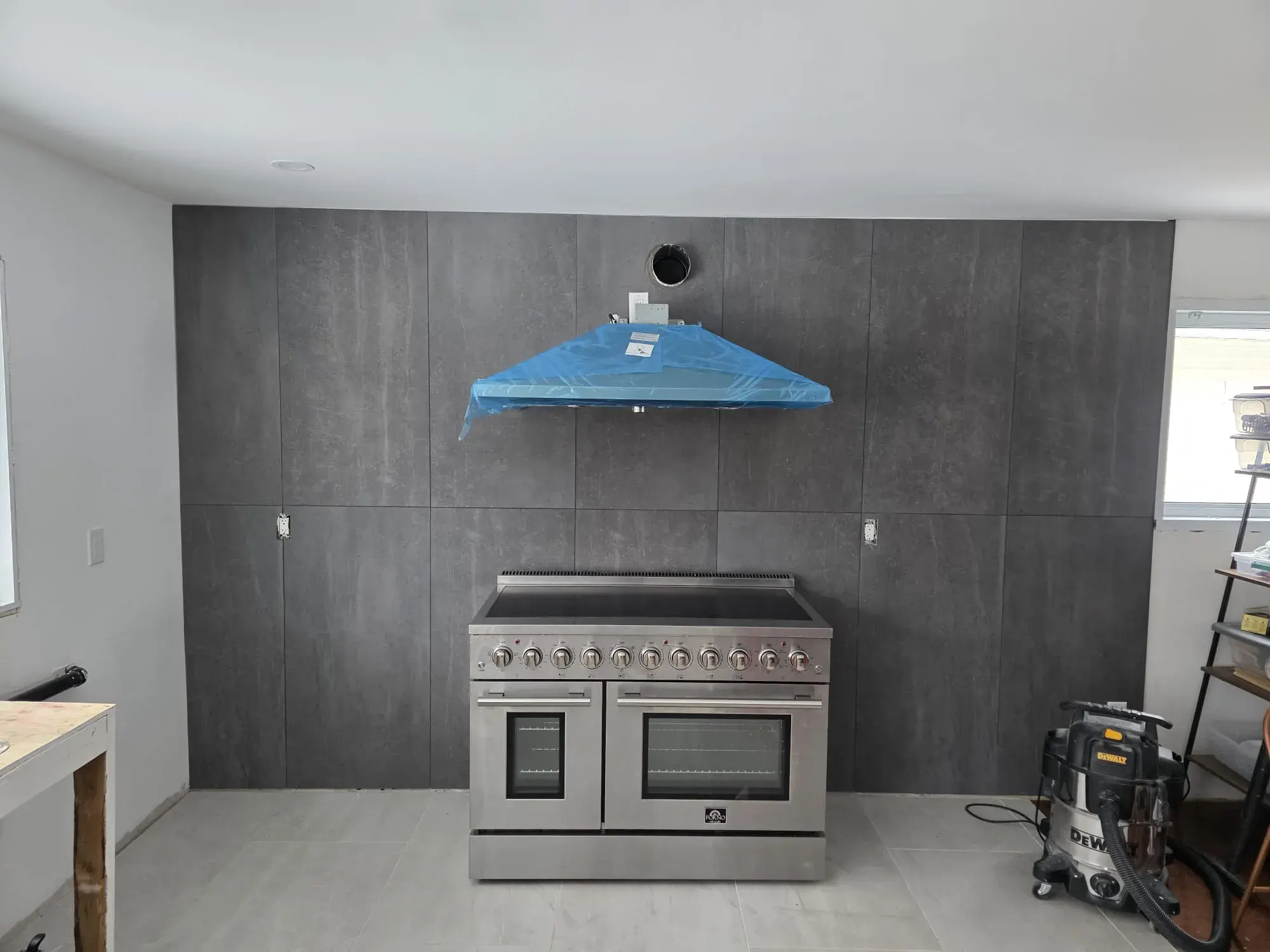 Tile installation completed as part of a custom kitchen project