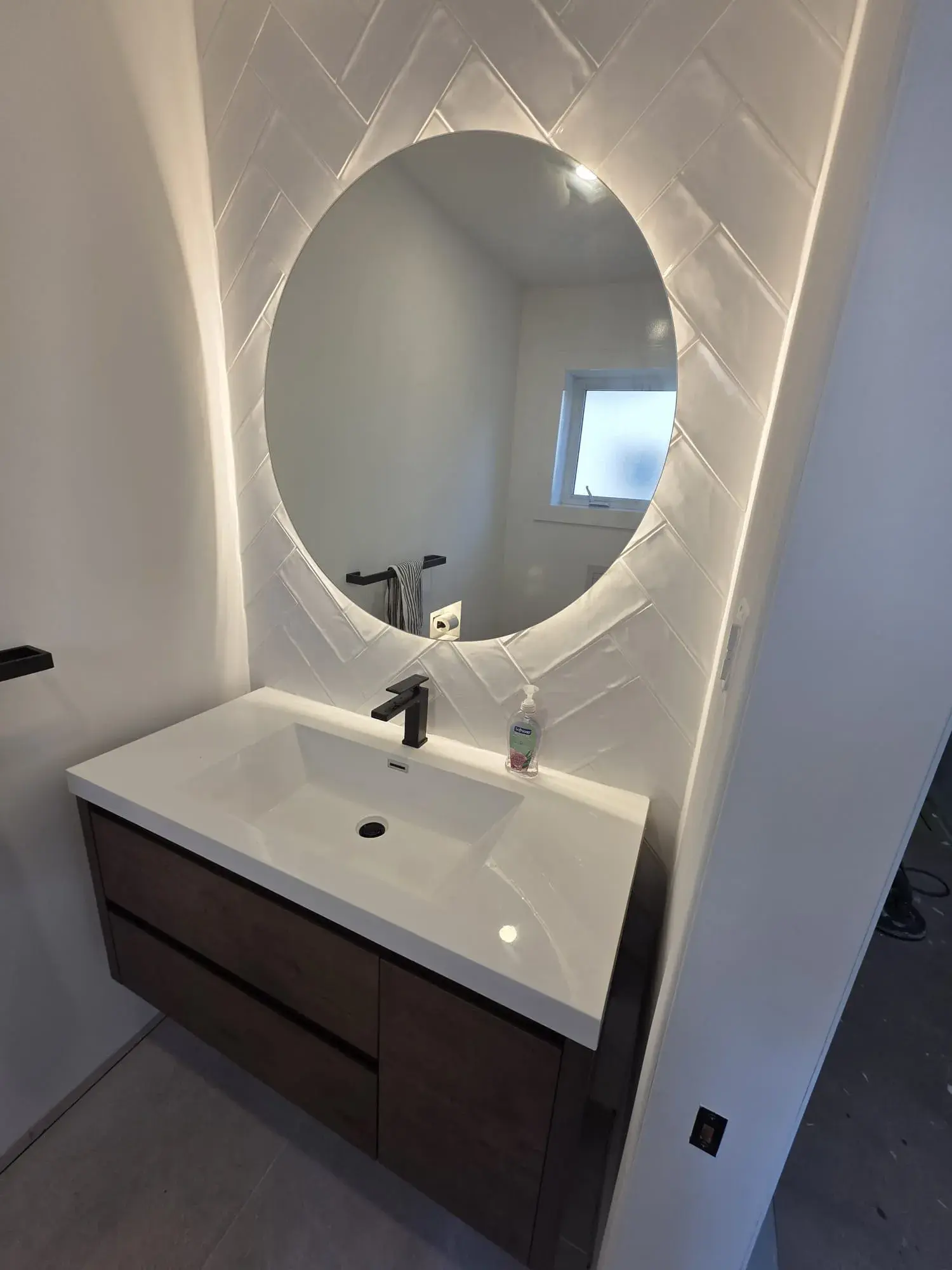 Custom half-bath vanity with coordinated tile work